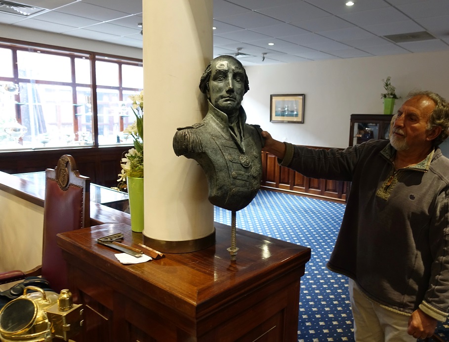Paul Sutton preparing to install the bust